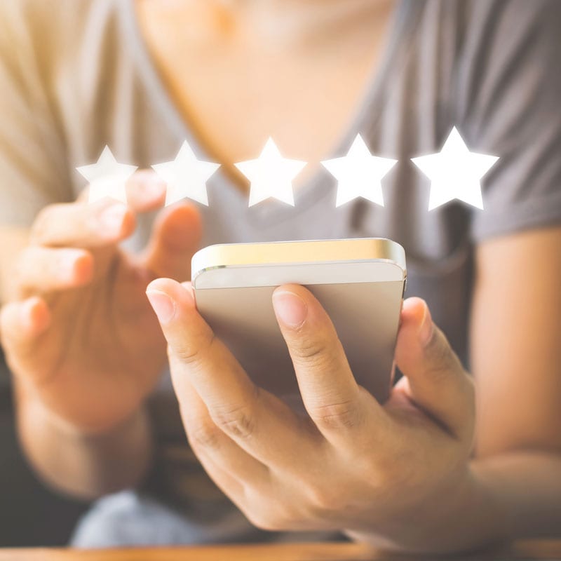 person learning how to promote your business locally by managing reviews on google my business